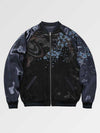 Black bomber jacket with abstract floral design on a light gray background