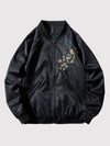 Black bomber jacket with floral embroidery on a light gray background