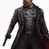 Character in a dark coat with a gun, standing against a plain background