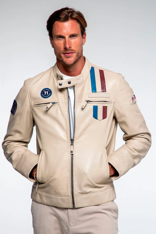 Man wearing a beige jacket with patches on a white background