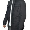 Person wearing a black coat with a hood in an urban setting
