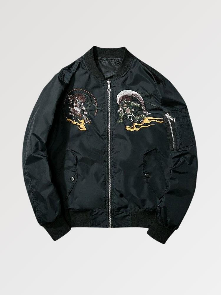 Black bomber jacket with embroidered designs on a light gray background