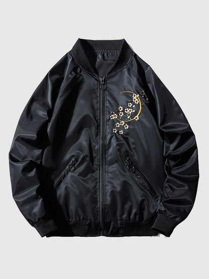 Black bomber jacket with floral embroidery on a light gray background