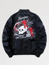 Black jacket with graphic design on the back against a light gray background