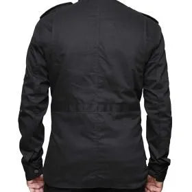 Black long-sleeve shirt worn by a person on a white background
