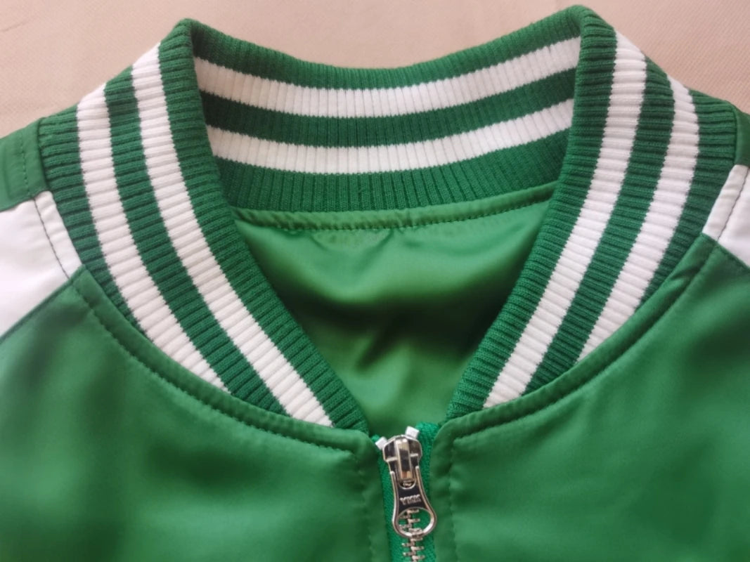 Close-up of a green jacket with white stripes on the collar against a beige background