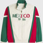Cream-colored jacket with green and red accents featuring 'MEXICO 1986' text and soccer ball graphic.