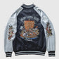 Embroidered jacket with 'Seven Lucky Gods' design on a light gray background