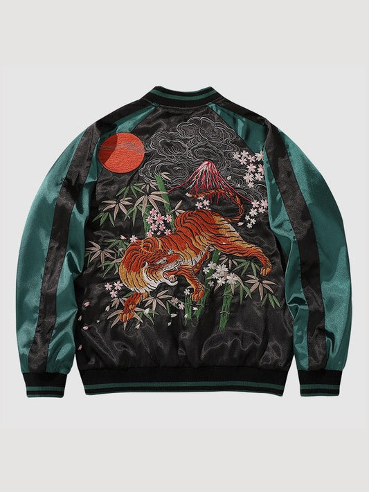 Embroidered jacket with a fox and mountain design on a light gray background