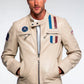 Man wearing a beige jacket with patches on a white background