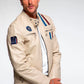 Man wearing a beige jacket with patches on a white background