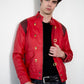 Man wearing a red jacket with gold buttons against a white background