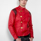 Man wearing a red jacket with gold buttons on a white background