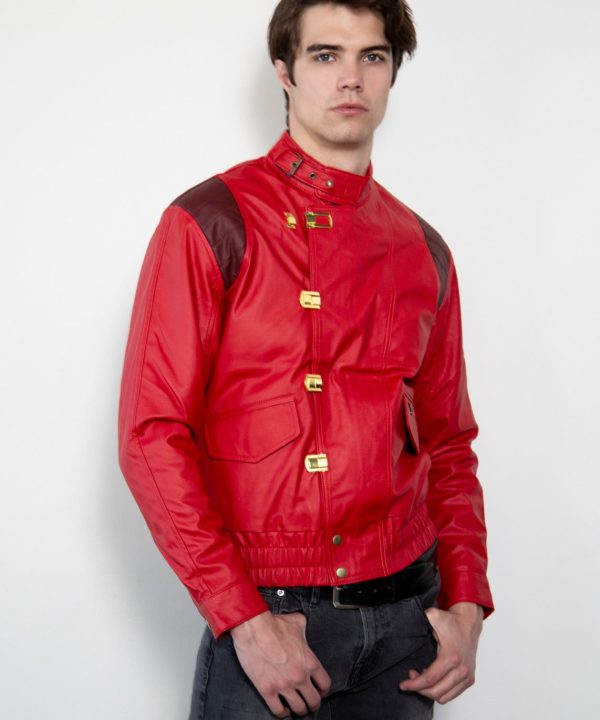 Man wearing a red jacket with gold buttons on a white background
