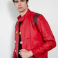 Man wearing a red jacket with gold buttons on a white background