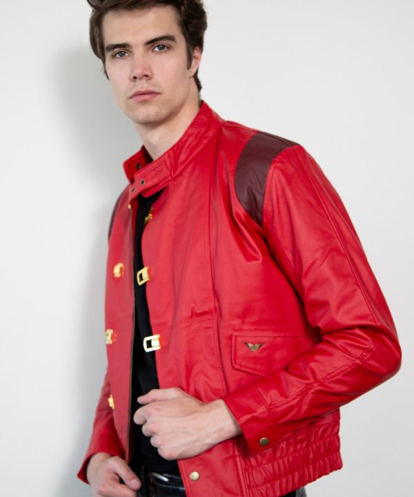 Man wearing a red jacket with gold buttons on a white background