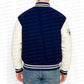 Navy and white varsity jacket with 'urban collections' branding on a white background