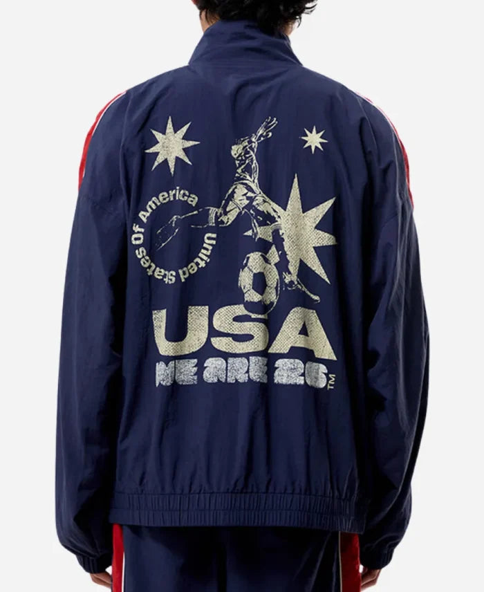 Navy blue jacket with 'USA' and star design on the back, worn by a person.