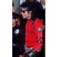 Person in a red outfit with black accents and sunglasses, standing next to a police officer.