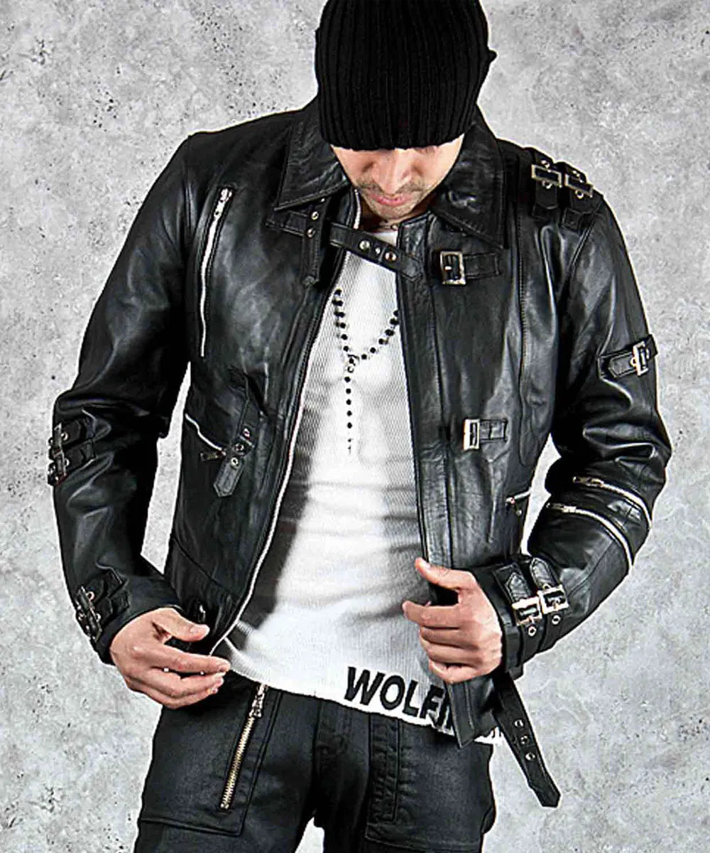 Person wearing a black leather jacket and white shirt with 'Wolfe' branding on a gray background