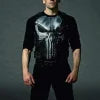 Person wearing a black leather outfit with a helmet, resembling a superhero costume.