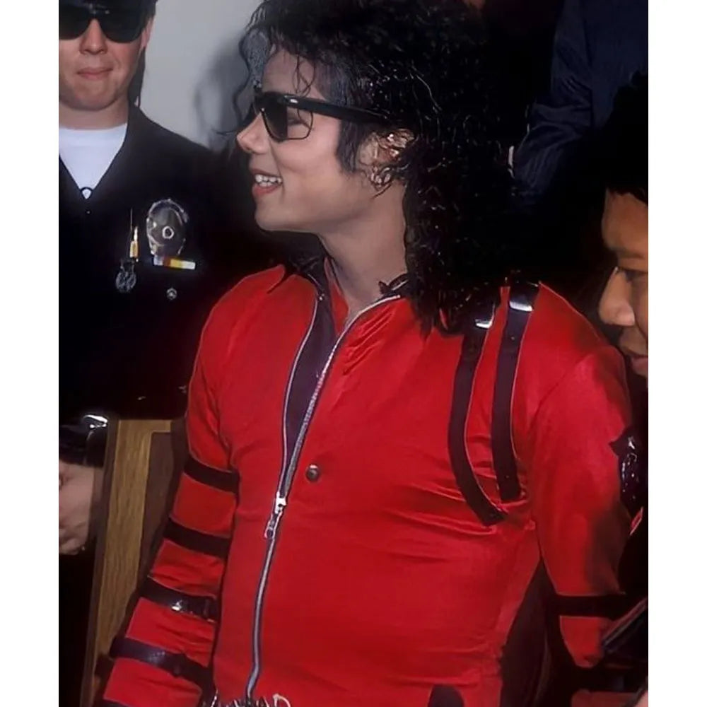 Person wearing a red outfit with suspenders in a close-up shot.