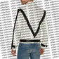 Person wearing black suspenders over a white shirt with 'urban collections' branding in the background.