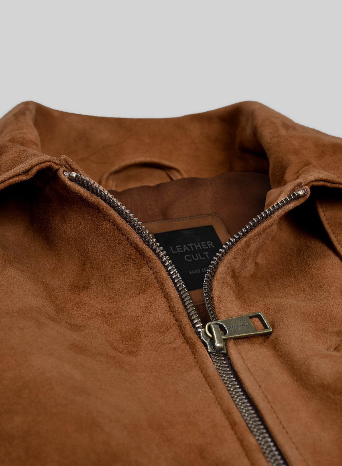 Armie Hammer Man from U.N.C.L.E. Tan Bomber Leather Jacket – close-up detail of leather and stitching