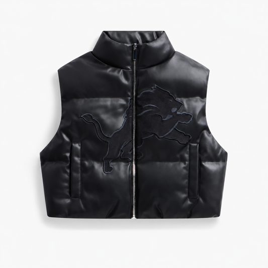 Detroit Lions women's black faux leather cropped puffer vest, front view without dangling cords or front brand patch