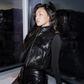Detroit Lions women's black cropped faux leather vest modeled, without front patch or dangling hem cords