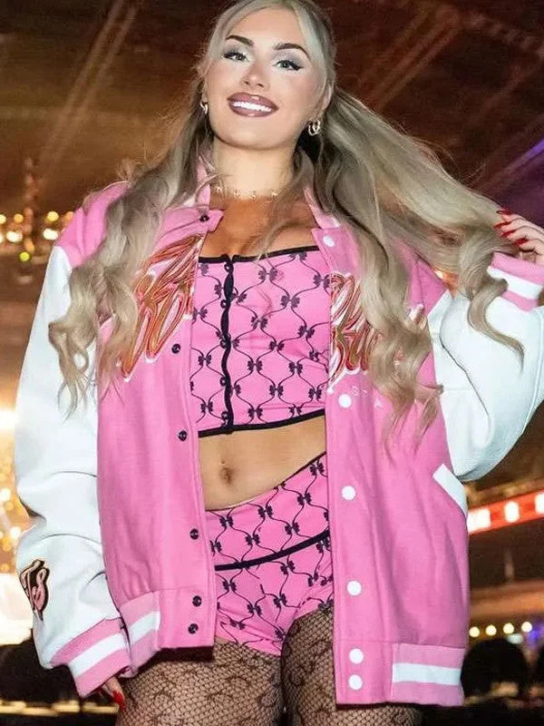 Smiling front view of pink and white Tiffy Time varsity jacket with embroidered chest script and TS sleeve patch