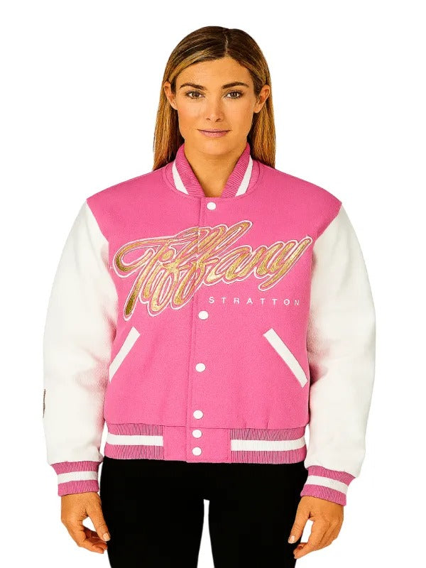 Back studio shot emphasizing TIFFY TIME chenille clock emblem on pink varsity jacket
